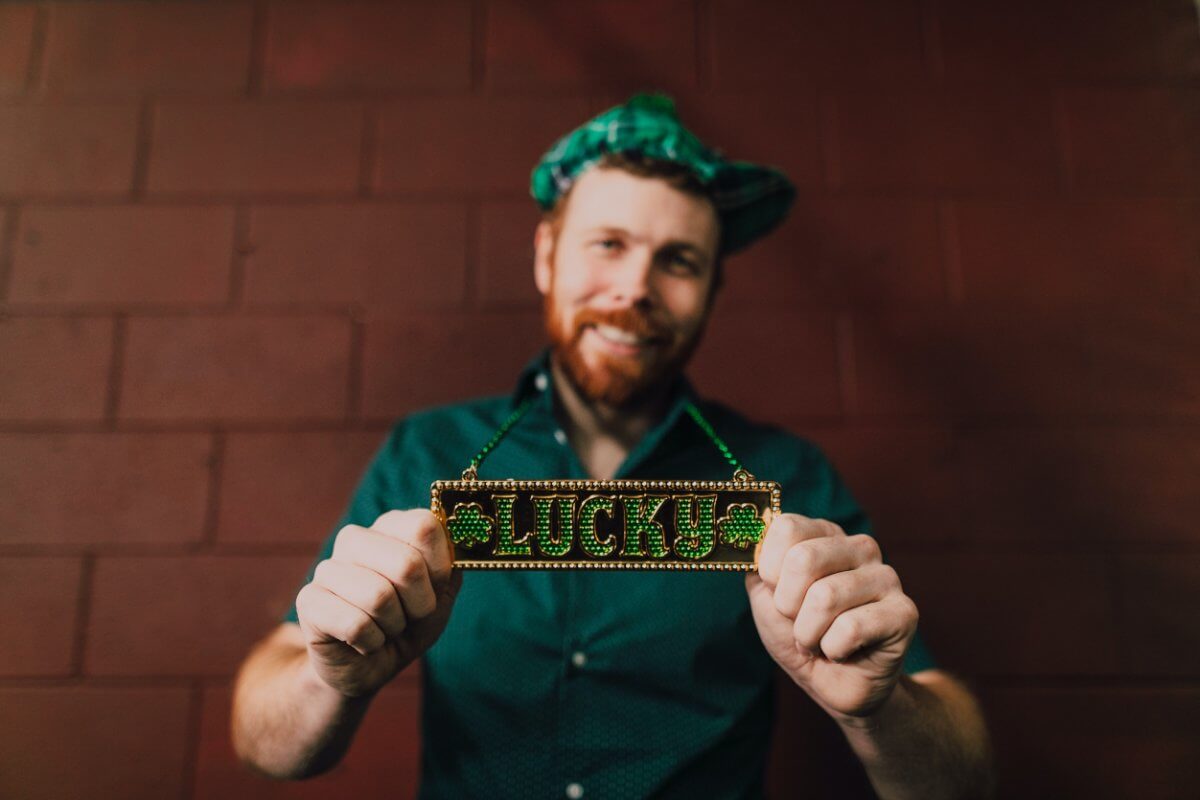 Irish Man Holding Signs Reading Lucky