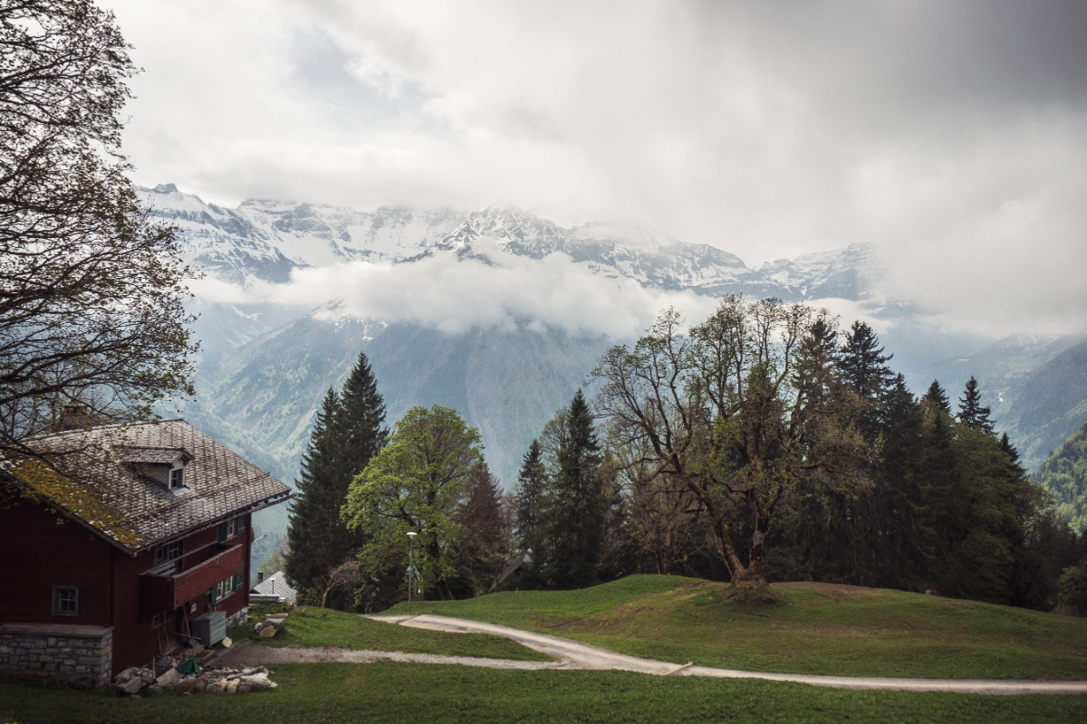 A Wooden House On The Hill Of A Mountain