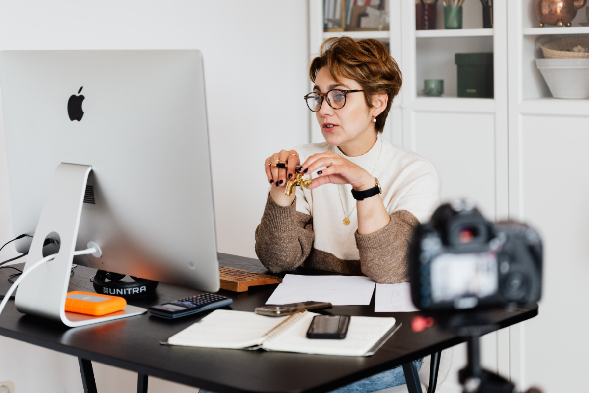 Woman Behind Mac Computer In Home Office