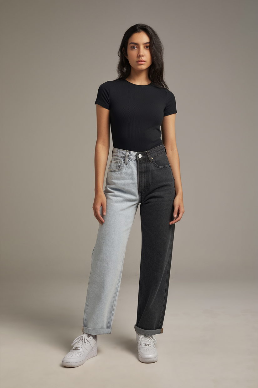 Two-tone jeans in light and dark wash, styled with a black bodysuit for a modern outfit.